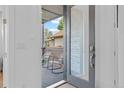 Inviting front porch showcases modern chairs, sleek railing, and clear glass door to the entry at 2107 S Grant St, Denver, CO 80210