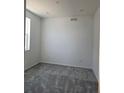 Cozy bedroom with plush gray carpeting, natural light, and freshly painted walls at 6066 Caribou Dr, Brighton, CO 80601