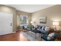 Inviting living room with hardwood floors, neutral walls, and stylish furnishings at 3232 Cimarron Pl, Superior, CO 80027