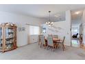 Cozy dining room with a chandelier, and traditional decor at 12935 Lake Circle Dr, Thornton, CO 80241