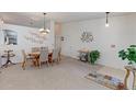 Bright dining room with a large table and neutral decor at 12935 Lake Circle Dr, Thornton, CO 80241