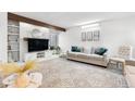Inviting living area showcasing a decorative fireplace, neutral tones, and comfortable seating for relaxation at 1490 S Salem Way, Aurora, CO 80012