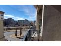 View from balcony overlooking city buildings, trees, and a street at 475 W 12Th Ave # 8H, Denver, CO 80204