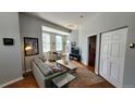 Cozy living room with lots of natural light, comfortable seating, and hardwood floors at 475 W 12Th Ave # 8H, Denver, CO 80204