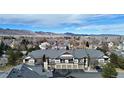 Exterior view of condo with mountain views, two-story building, and parking at 7402 S Quail Cir # 1116, Littleton, CO 80127