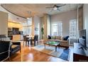 Open-concept living area with modern decor, hardwood floors, and abundant natural light, perfect for relaxation at 1700 Bassett St # 504, Denver, CO 80202