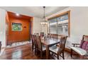 Inviting dining room featuring hardwood floors, modern lighting, and mountain views at 200 Rachel Ln, Breckenridge, CO 80424