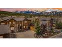Stunning multi-story home with mountain views, lush landscaping, and a large driveway at 200 Rachel Ln, Breckenridge, CO 80424