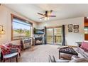 Cozy living room showcasing a stone fireplace, mountain views, and comfortable seating at 200 Rachel Ln, Breckenridge, CO 80424