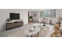 Bright living room featuring neutral decor, large windows, and comfortable seating area at 1243 N Washington St # 308, Denver, CO 80203