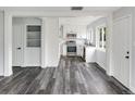 Modern kitchen featuring stainless steel appliances, white cabinetry, and sleek countertops at 1345 Holly St, Denver, CO 80220