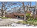 Covered parking with brick structure and address number at 3260 47Th St # 108A, Boulder, CO 80301