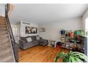 Living room with hardwood floors and gray sectional at 8995 Field St # 12, Broomfield, CO 80021