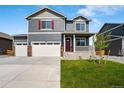 Two-story home with gray siding, red shutters, and a two-car garage at 4101 Marble Dr, Mead, CO 80504