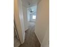 This hallway has carpeted floors and a view into the bedroom at 894 S Krameria St, Denver, CO 80224