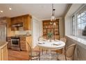 Inviting dining area featuring a stylish table, chairs, and built-in hutch for storage at 3127 And 3125 N Raleigh St, Denver, CO 80212