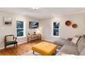 Bright and airy living room with large windows, hardwood floors, and comfortable seating at 3175 S Pennsylvania St, Englewood, CO 80113