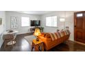 Cozy living room with hardwood floors, plenty of natural light, and stylish furnishings at 2080 Fulton St, Aurora, CO 80010