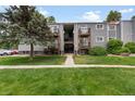Apartment exterior has well maintained landscaping and shared stairs at 16359 W 10Th Ave # T1, Golden, CO 80401