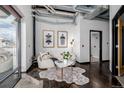 Stylish waiting area with a sofa, coffee table and view of a bath at 2142 Curtis St # 101, Denver, CO 80205