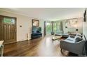Bright living room with hardwood floors, large windows, and comfortable seating at 8600 W 2Nd Ave, Lakewood, CO 80226