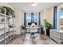Cozy home office featuring hardwood floors and large windows at 26385 E Canal Pl, Aurora, CO 80018