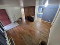 Spacious living room with hardwood floors, adjacent kitchen, and potential for custom design at 1078 Elmira St, Aurora, CO 80010