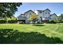 Spacious backyard featuring a large lawn and a private deck at 3325 W 111Th Loop # C, Westminster, CO 80031