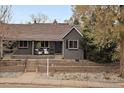 Charming home with a well-maintained front yard and inviting curb appeal at 3327 Irving St, Denver, CO 80211