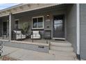 Inviting front porch with seating, perfect for relaxing and enjoying the neighborhood views at 3327 Irving St, Denver, CO 80211