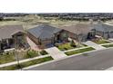 Expansive view of home in a neighborhood community surrounded by well-maintained landscaping at 23030 E Del Norte Cir, Aurora, CO 80016