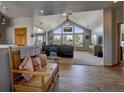 Spacious living room featuring high ceilings and large windows for natural light at 5910 Mccart Ranch Cir, Elizabeth, CO 80107