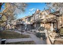 Inviting townhome with landscaped front yard and multiple entrances at 6762 E Briarwood Dr, Centennial, CO 80112