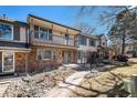 Attractive townhome with brick details, well-kept landscaping, and private balcony at 6762 E Briarwood Dr, Centennial, CO 80112