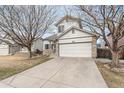 Charming two-story home featuring stone accents, a two-car garage, and a well-maintained front yard at 1663 W 135Th Way, Denver, CO 80234