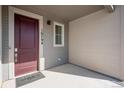 Inviting front porch with stylish front door, house numbers and Tri Pointe Homes doormat at 16794 W 94Th Way, Arvada, CO 80007