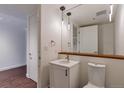 Modern bathroom with a vanity, large mirror, and updated fixtures at 1750 Wewatta St # 1102, Denver, CO 80202