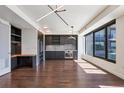 Modern kitchen featuring sleek cabinets, stainless steel appliances, and hardwood floors at 1750 Wewatta St # 1102, Denver, CO 80202