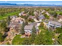 Stunning aerial view of the property showcasing its prime location near a golf course and mountain views at 9980 Newton Ct, Westminster, CO 80031