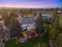 Expansive backyard with a large deck, outdoor seating, and lush green lawn at 9980 Newton Ct, Westminster, CO 80031