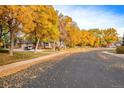 Residential street lined with trees in fall foliage at 5202 Union Ct # 2, Arvada, CO 80002