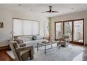 Bright living room with modern ceiling fan, stylish furniture, and inviting atmosphere at 1035 S Elizabeth St, Denver, CO 80209