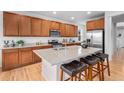 Modern kitchen featuring granite countertops, stainless appliances, and a functional center island at 1168 Basalt Ridge Loop, Castle Rock, CO 80108