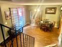 Inviting dining area with wood floors, natural light, and staircase at 19156 E Arizona Pl, Aurora, CO 80017