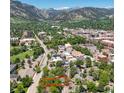 Stunning aerial view of a home in a vibrant city neighborhood with mountain views at 1519 16Th St, Boulder, CO 80302