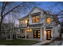 Charming two-story home with a modern design, brick accents, and a welcoming front porch and balcony at 2948 S Clarkson St, Englewood, CO 80113