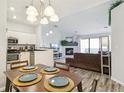 Open-concept dining and living area with modern finishes and ample natural light at 7394 S Alkire St # 307, Littleton, CO 80127