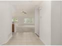 Clean entryway with tile flooring flowing into a spacious living area filled with natural light at 8267 S Sicily Ct, Aurora, CO 80016