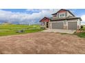 Charming two-story home with a three-car garage and large driveway in a rural setting at 28495 La Donna Vista Ln, Elizabeth, CO 80107