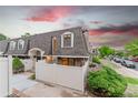 Charming townhome featuring a privacy fence, well-manicured bushes, and a quaint outdoor space at 15491 E Wyoming Dr # A, Aurora, CO 80017